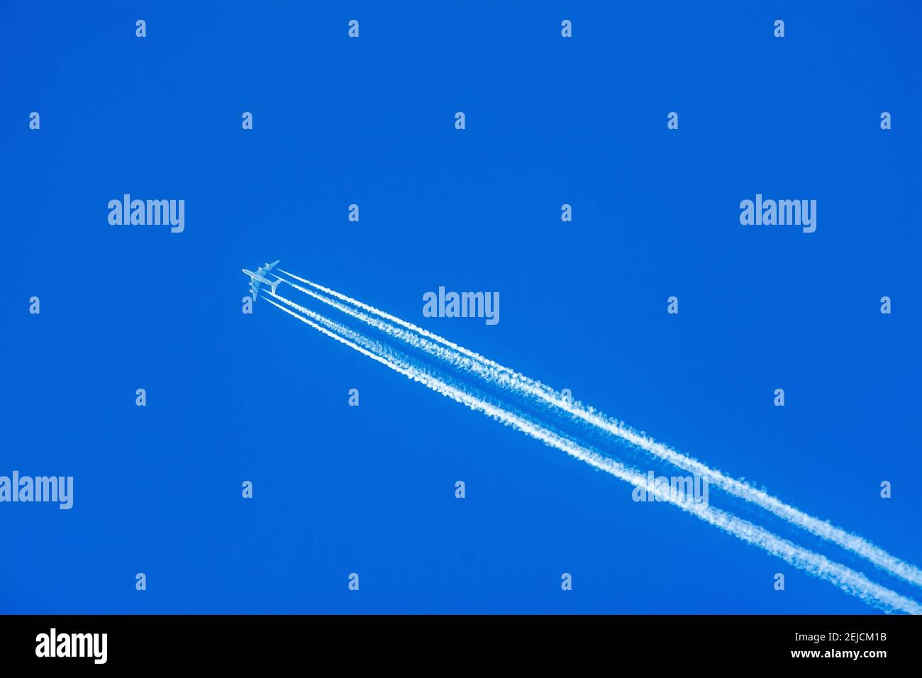 Vapor trail of the airplane in a blue sky Stock Photo