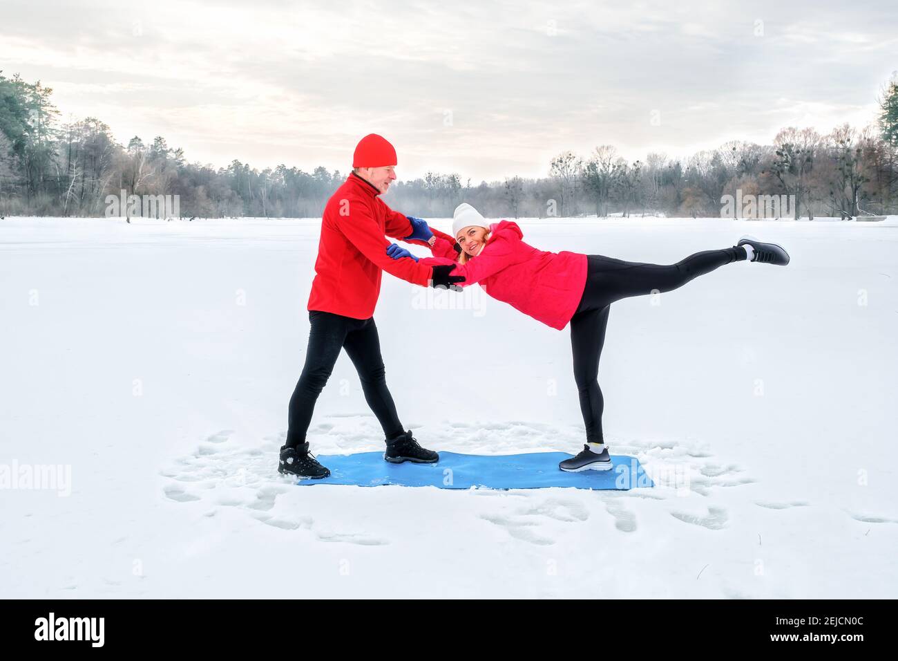 Senior couple warming before warms up and does stretching before workout  Stock Photo