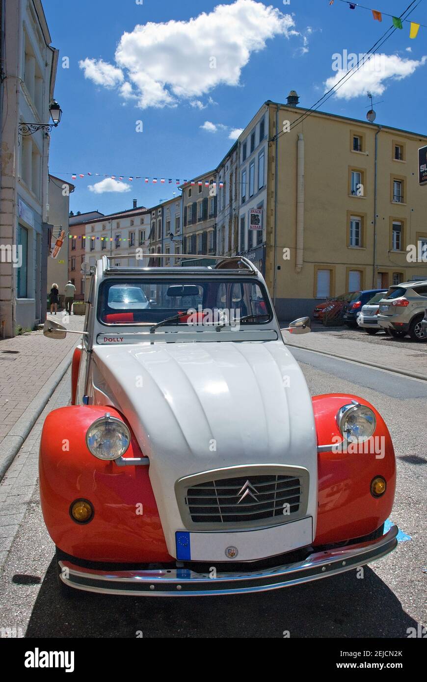 2CV, red and white dolly duck in a small French town Stock Photo