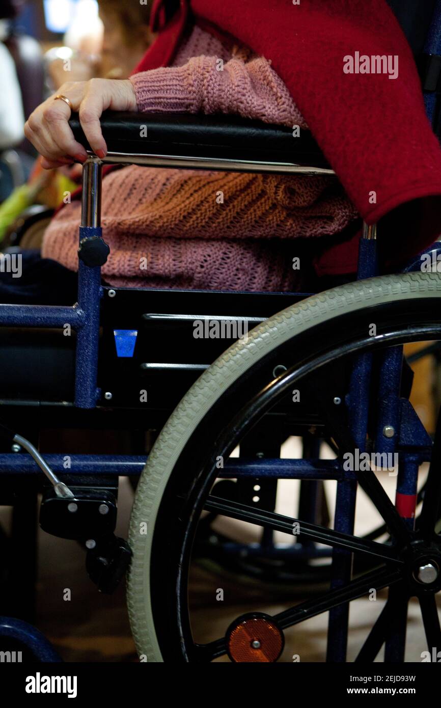 Elderly person in a wheelchair in a retirement home. Stock Photo
