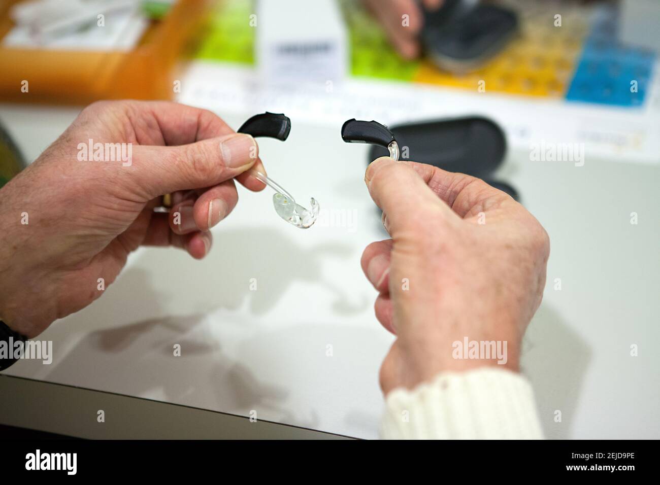 Adjustment of hearing aids at a hearing care professional Stock Photo