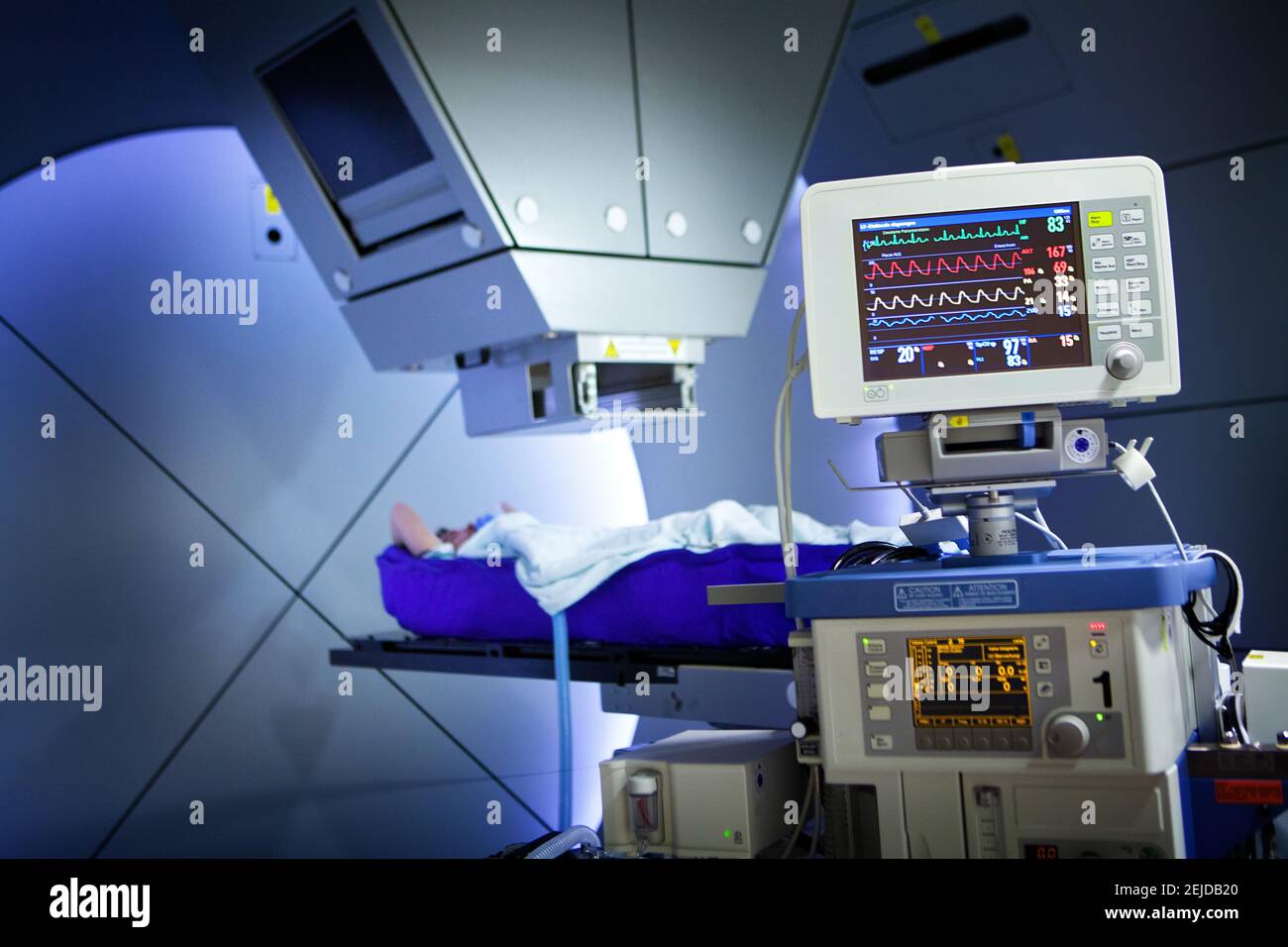 Proton therapy irradiates cancer cells with a beam of protons inside the tumor. Stock Photo