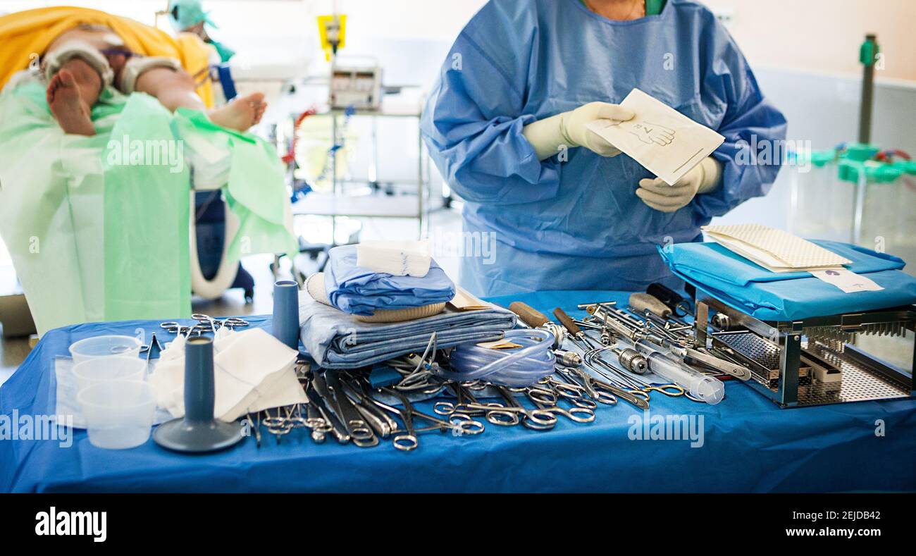 Table of surgical instruments for orthopedics in an operating theater. Stock Photo