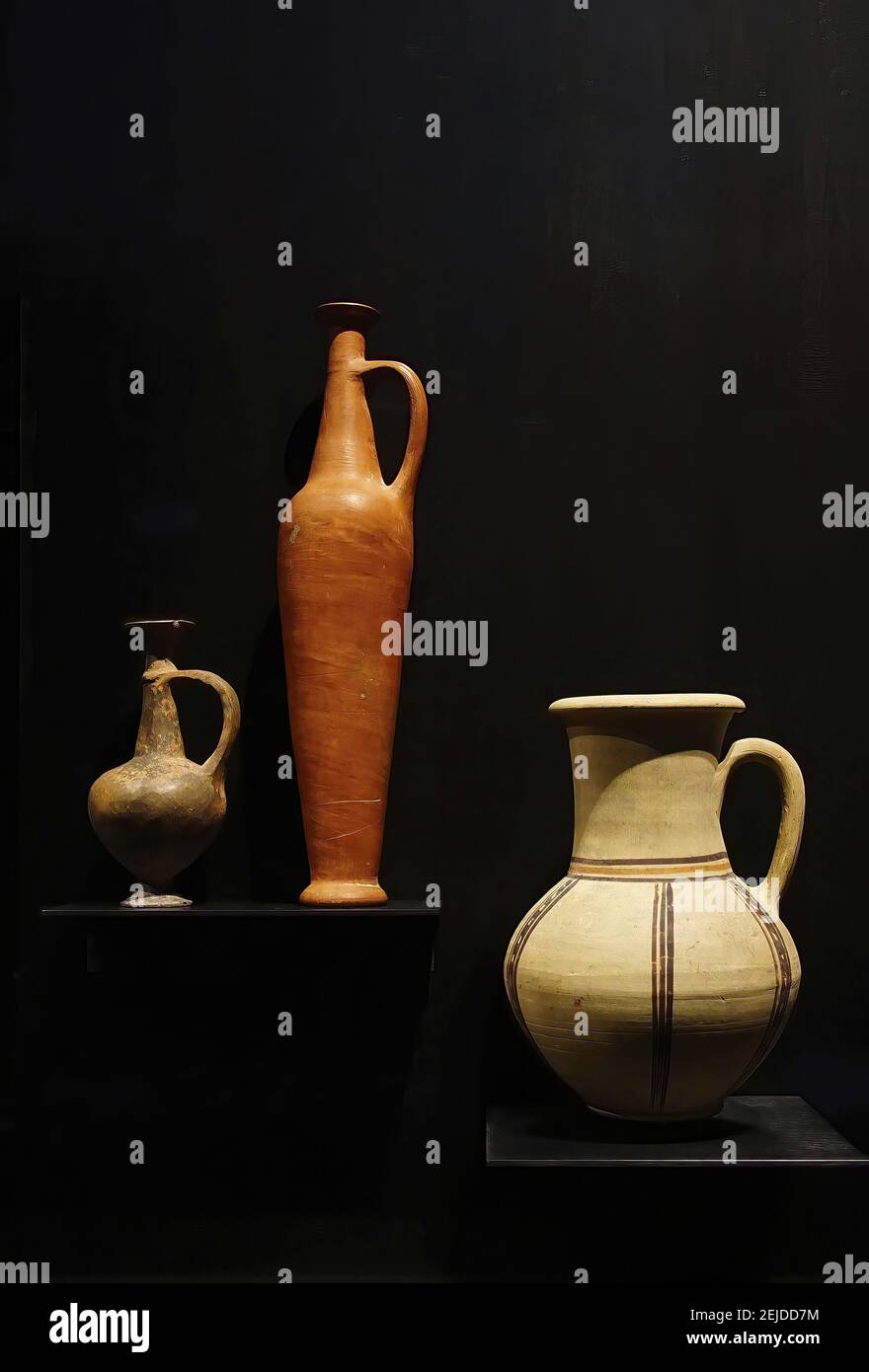 Vertical shot of jars & pottery vases from ancient Egypt, on a black