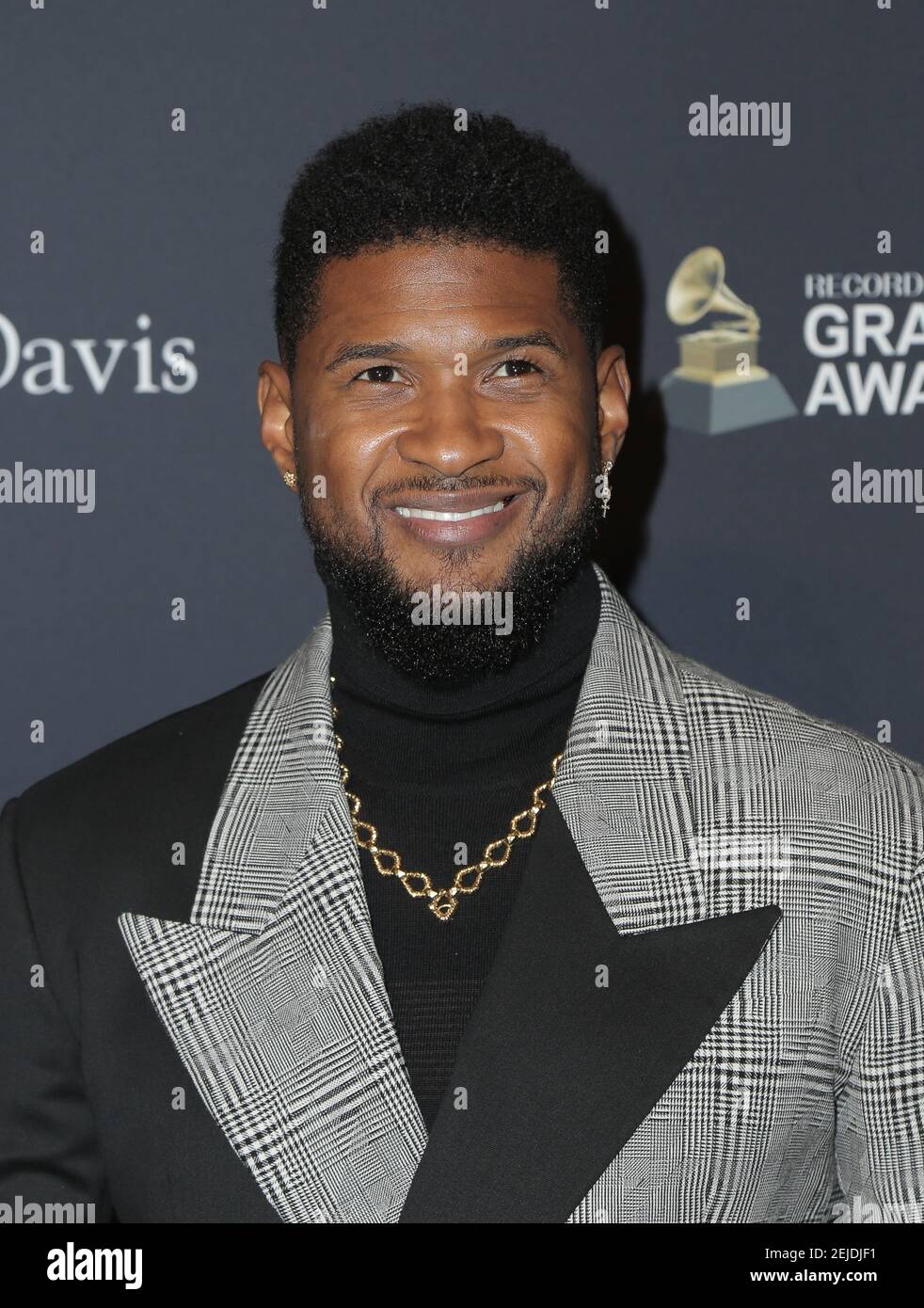 Usher walking the red carpet at the Clive Davis' 2020 Pre-Grammy Gala ...