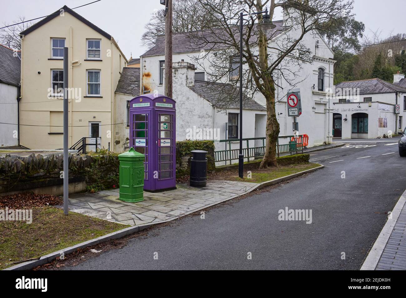K6 phonebox at Laxey station, Isle of Man now converted to a defibrillator box and painted mauve