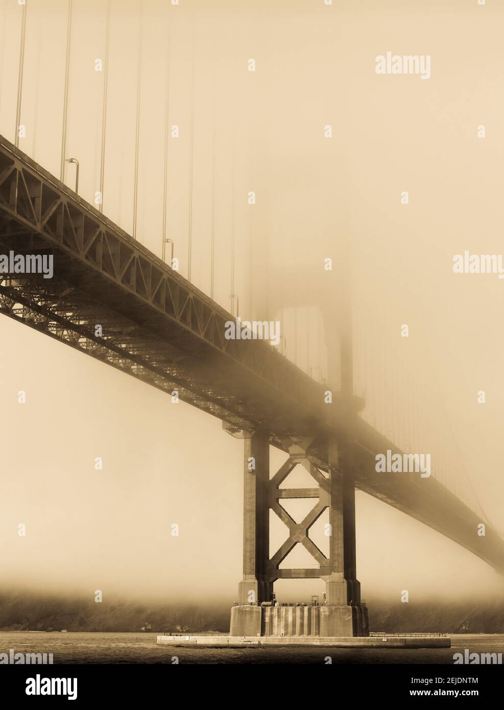Suspension bridge covered with fog, Golden Gate Bridge, San Francisco Bay, San Francisco, California, USA Stock Photo