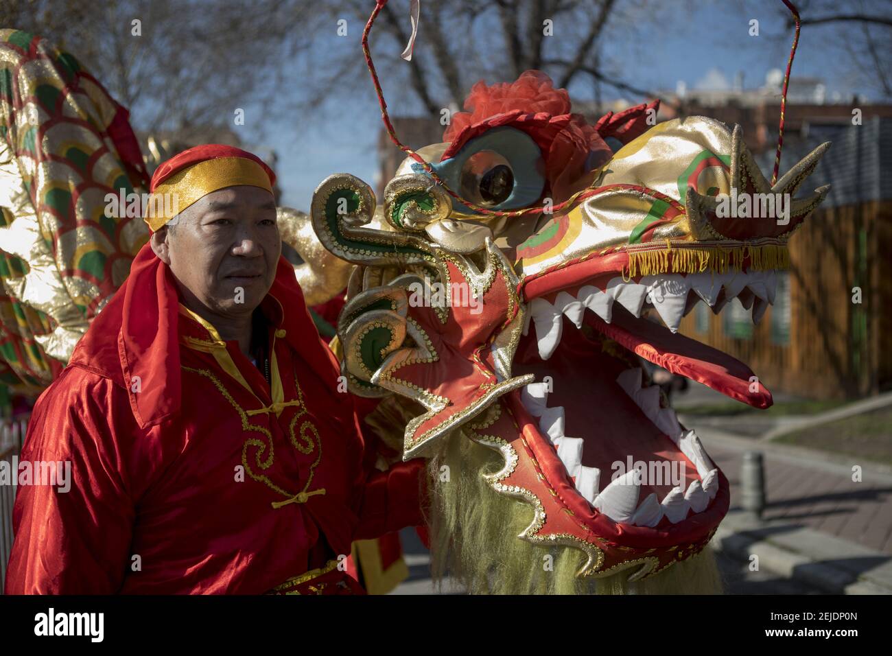 An artist with the a typical Chinese dragon during the parade. More ...