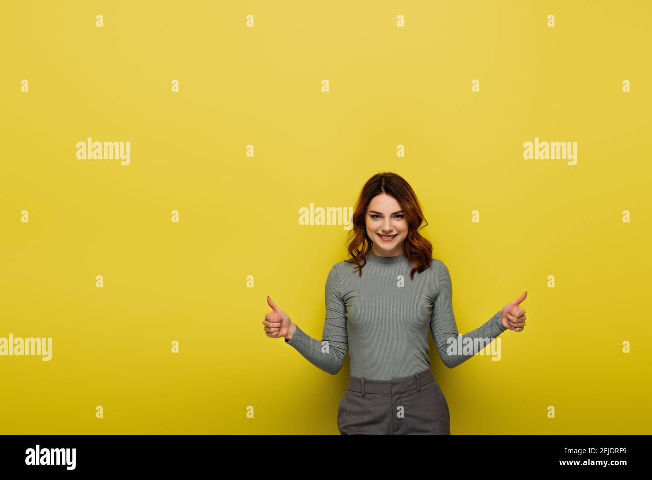Curly hair woman thumbs up hi-res stock photography and images - Alamy