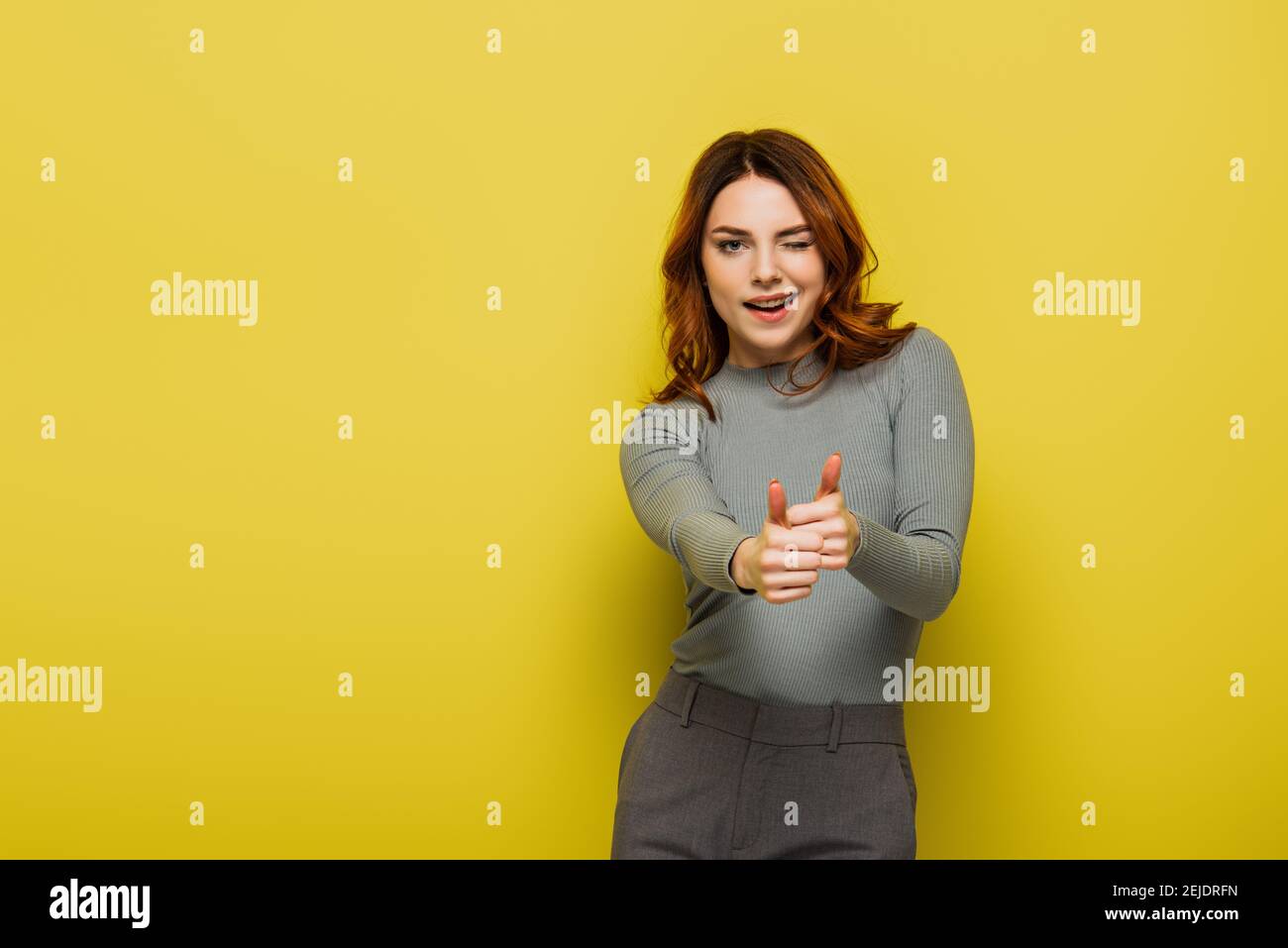 Curly hair woman thumbs up hi-res stock photography and images - Alamy