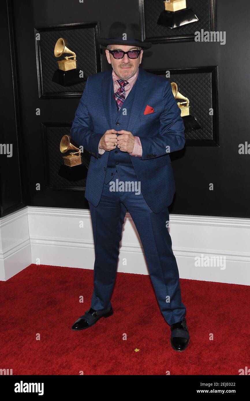 Elvis Costello arrives at the 62nd Annual Grammy Awards red carpet held