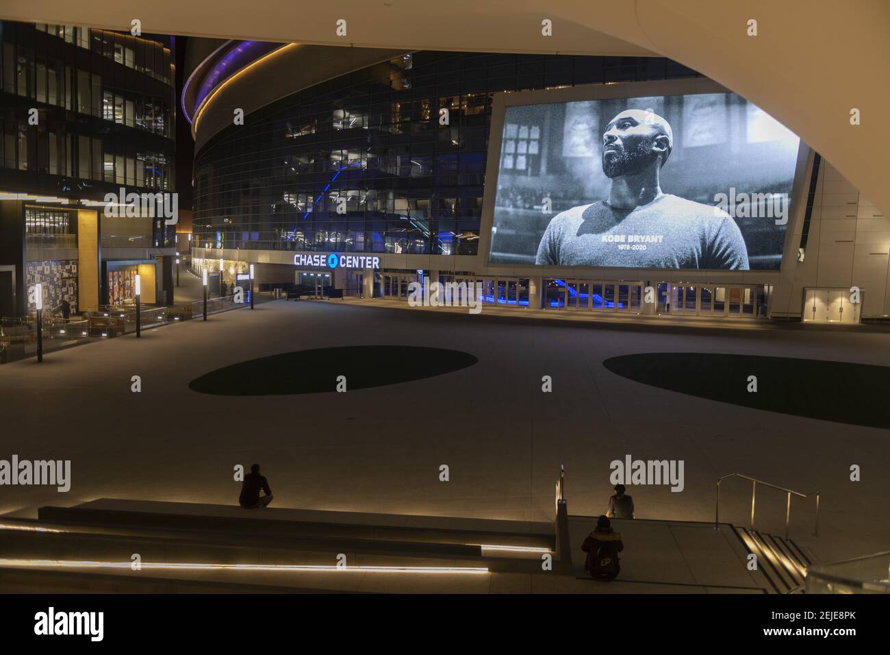 People gather quietly in front of a large image of former Los Angeles basketball player Kobe Bryant at Chase Center in San Francisco, California, United States on January 27, 2020 to pay tribute the legendary sportsman. The world famous NBA player was killed in a helicopter accident on January 26, 2020 when his private Sikorsky S-76B helicopter crashed into a mountain in Calasabas, California and killed 9 people, including his daughter Gigi Bryant. (Photo by Yichuan Cao/Sipa USA) Stock Photo