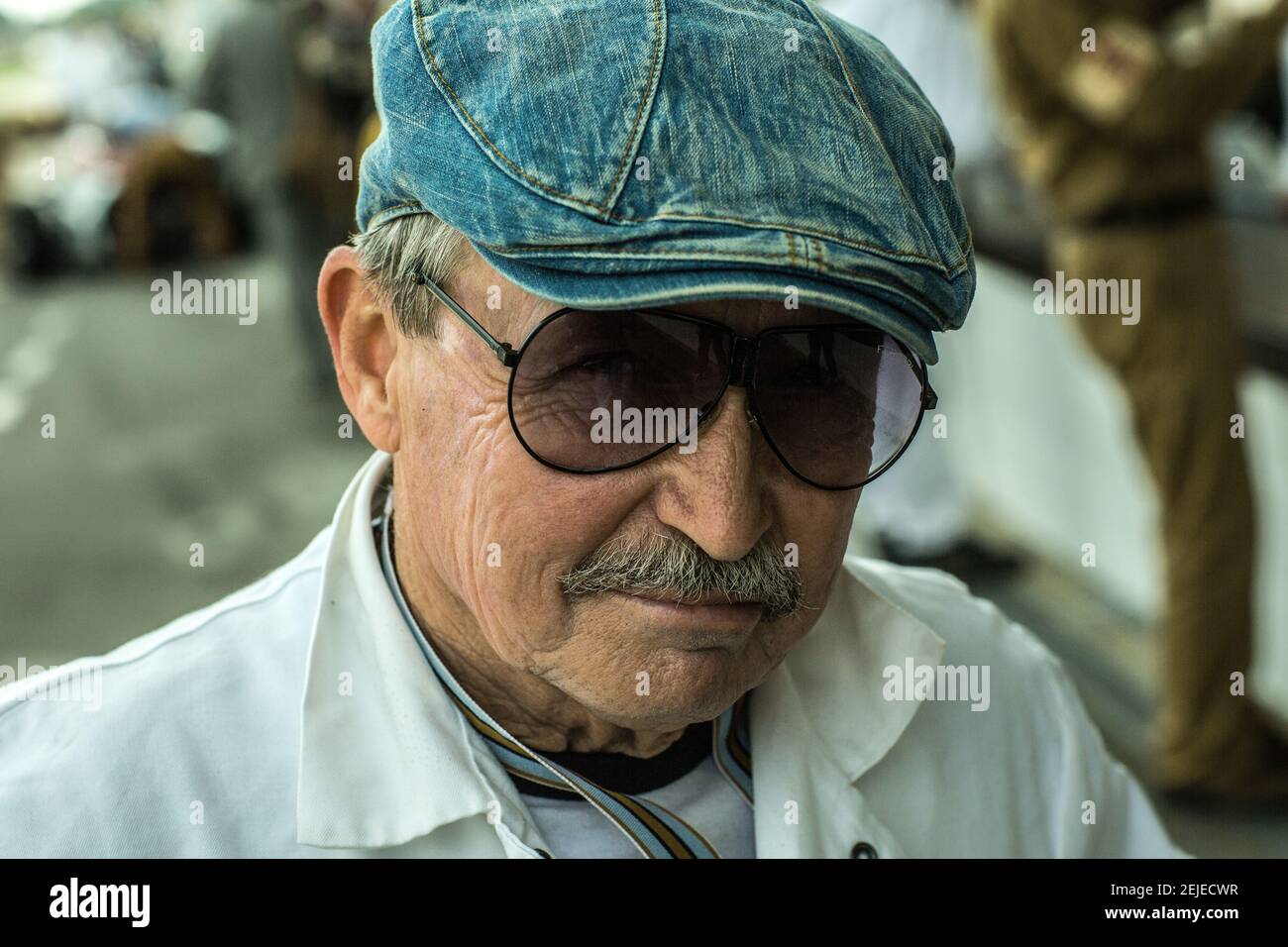 Mechanic with Newsboy Jeans Cap ,Denim Hat at the Goodwood Revival, West Sussex, England. Stock Photo