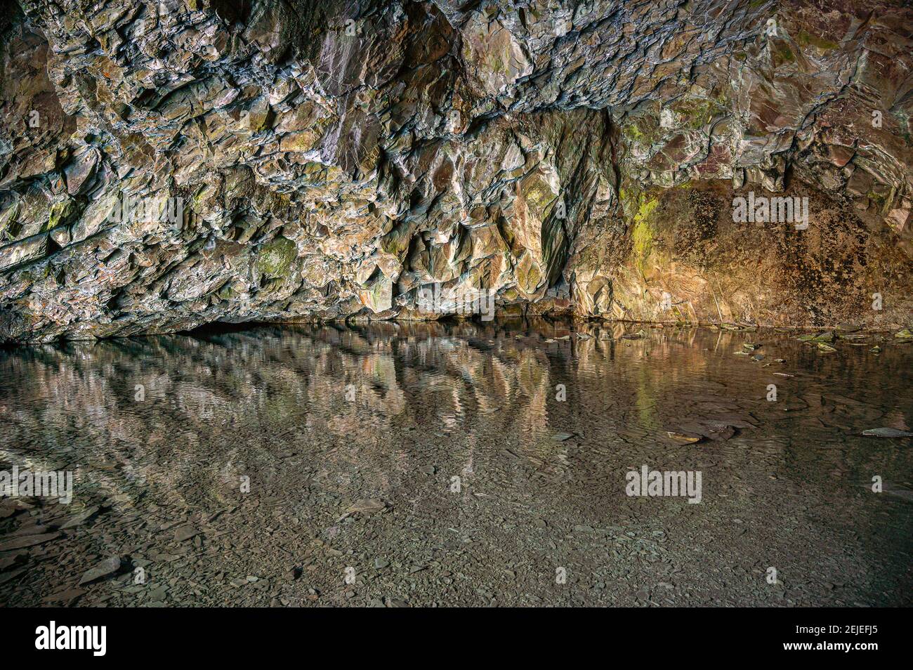 Inside Rydal Cave with clear waters Stock Photo