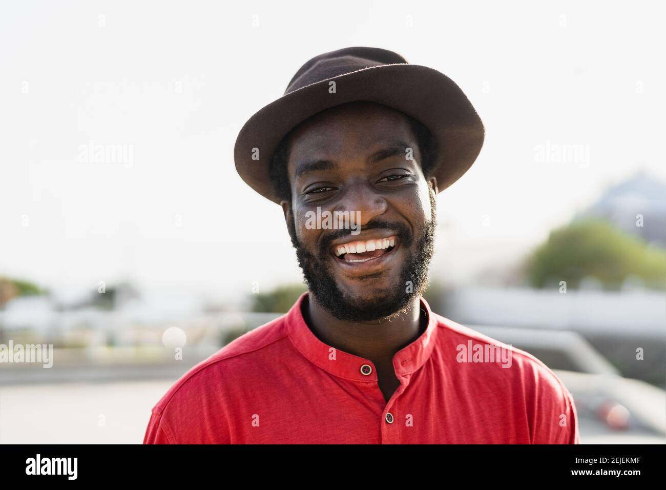 Happy african man having fun smiling in front of camera Stock Photo