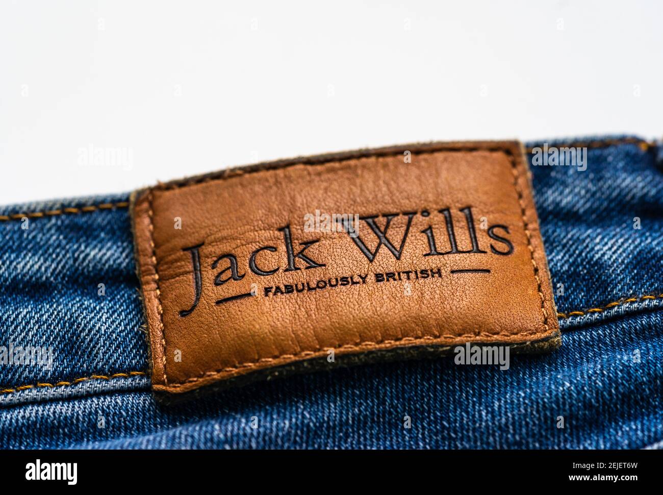 Jack Wills label on a blue denim jeans, Jack Wills is a British high street fashion clothing label Stock Photo
