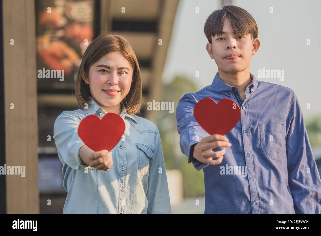 Asian couple holding red heart ,People happy sweet love Valentine ...