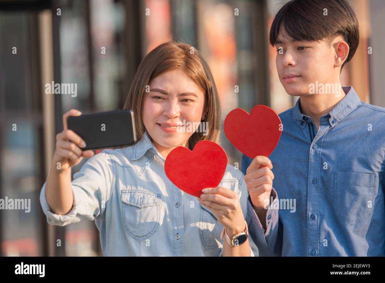 Asian couple hold red heart happy in love ,Couple selfie with ...