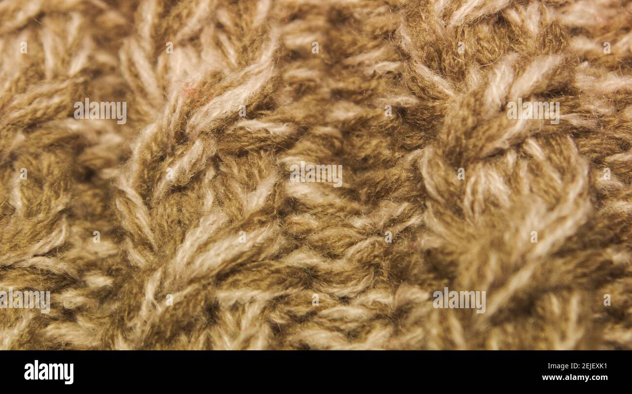 Closeup of ivory handmade knitted fabric (ribbing pattern Stock Photo ...