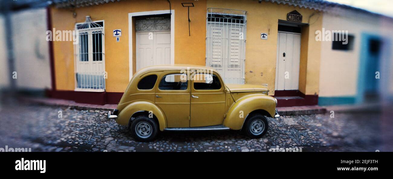 Vintage car on the cobblestone street, Trinidad, Sancti Spiritus, Cuba Stock Photo