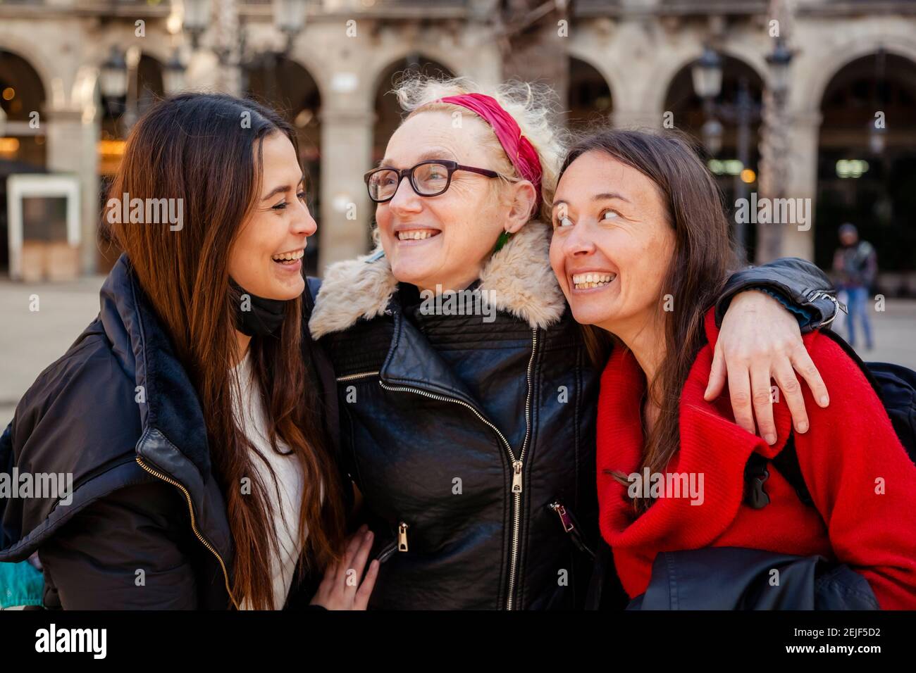 Authentic mixed generations women have fun together outdoor, talking and laughing. Concept: female friendship and connection Stock Photo