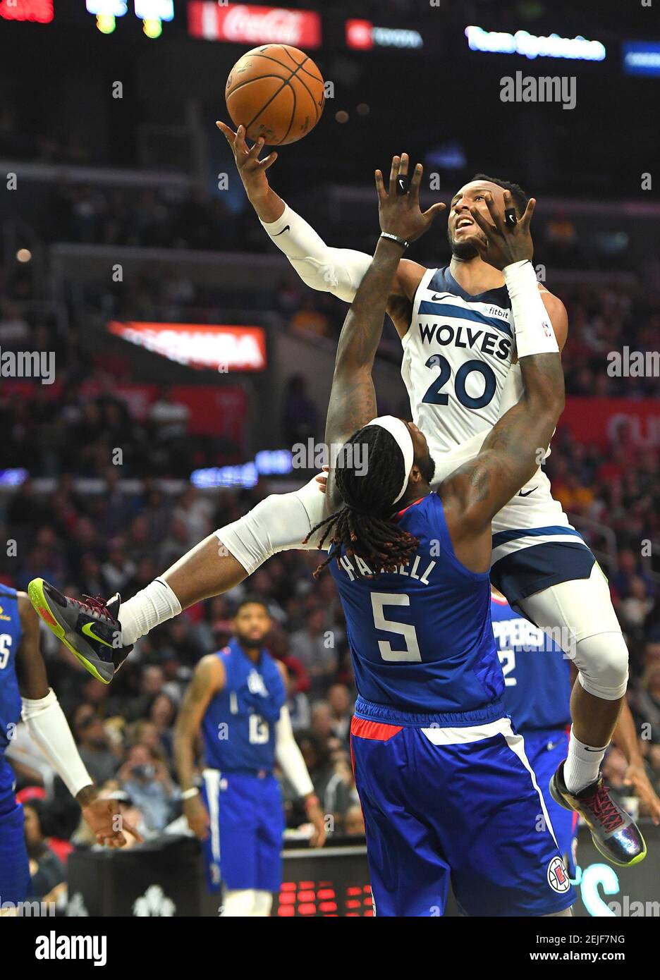 Feb 1, 2020; Los Angeles, California, USA; Los Angeles Clippers forward  Montrezl Harrell (5) is charged with an offensive foul on Minnesota  Timberwolves guard Josh Okogie (20) as he drives to the