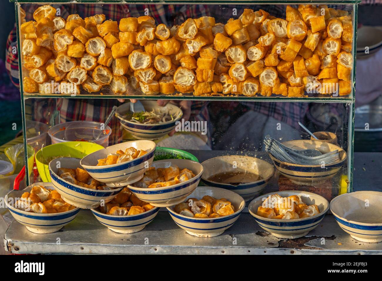 Beautiful photo of a deep-fried bread doughs at streetfood vendor  Stock Photo
