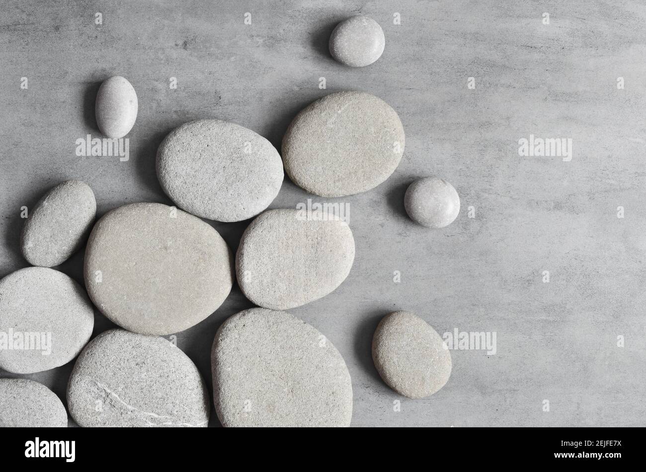 Flat lay composition with grey spa stones on grey background Stock ...