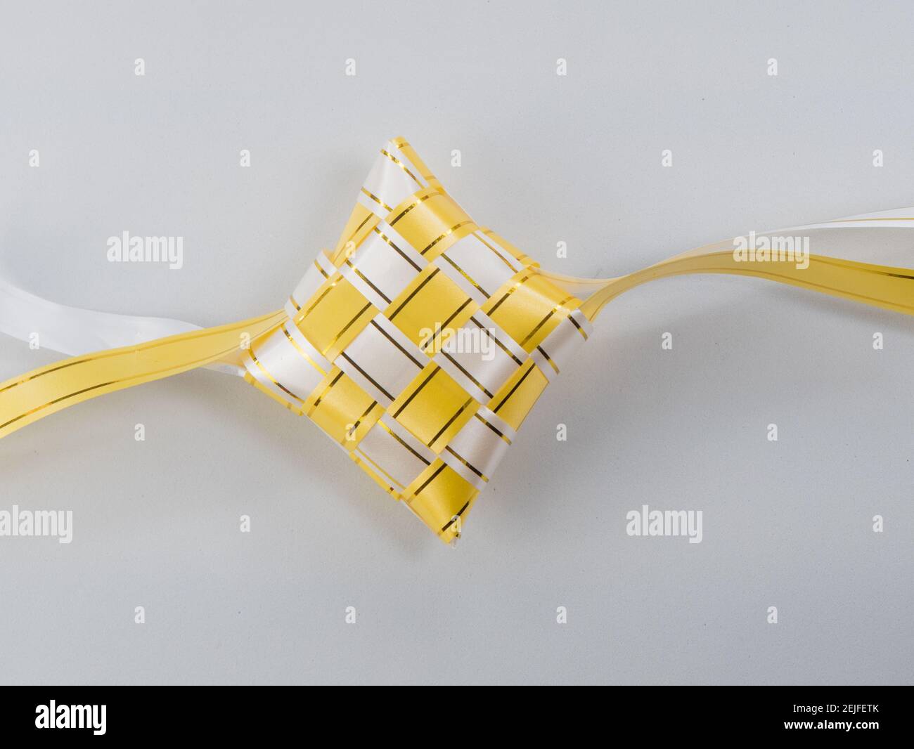 The beutiful white and gold colors ribbon of ketupat raya Stock Photo ...