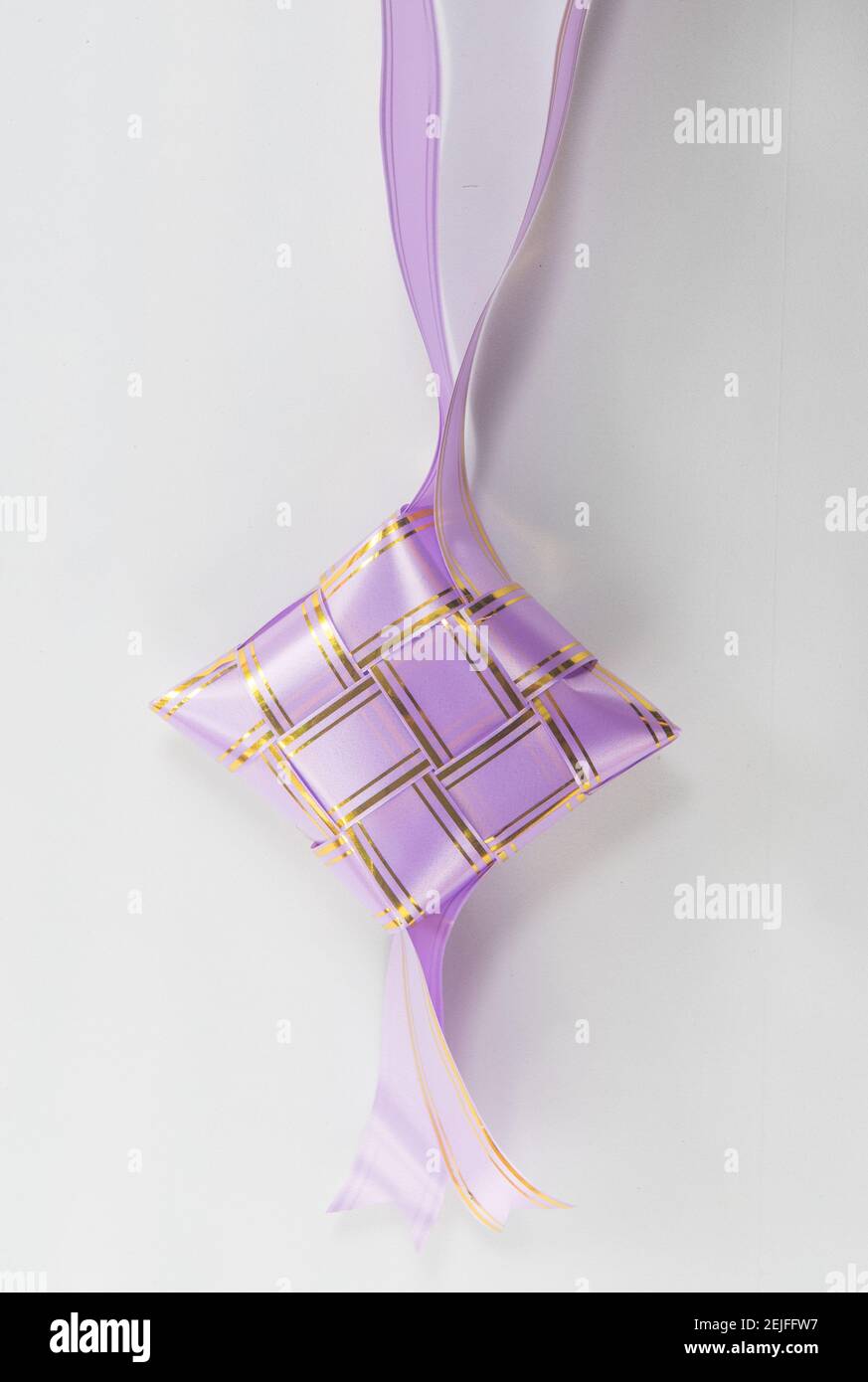 The beutiful purple colors ribbon of ketupat raya Stock Photo - Alamy