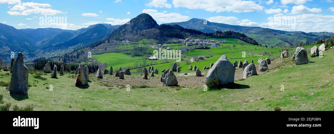 Rock formations on landscape with mountain range in the background, Boree, Ardeche, Rhone-Alpes, Massif Central, France Stock Photo