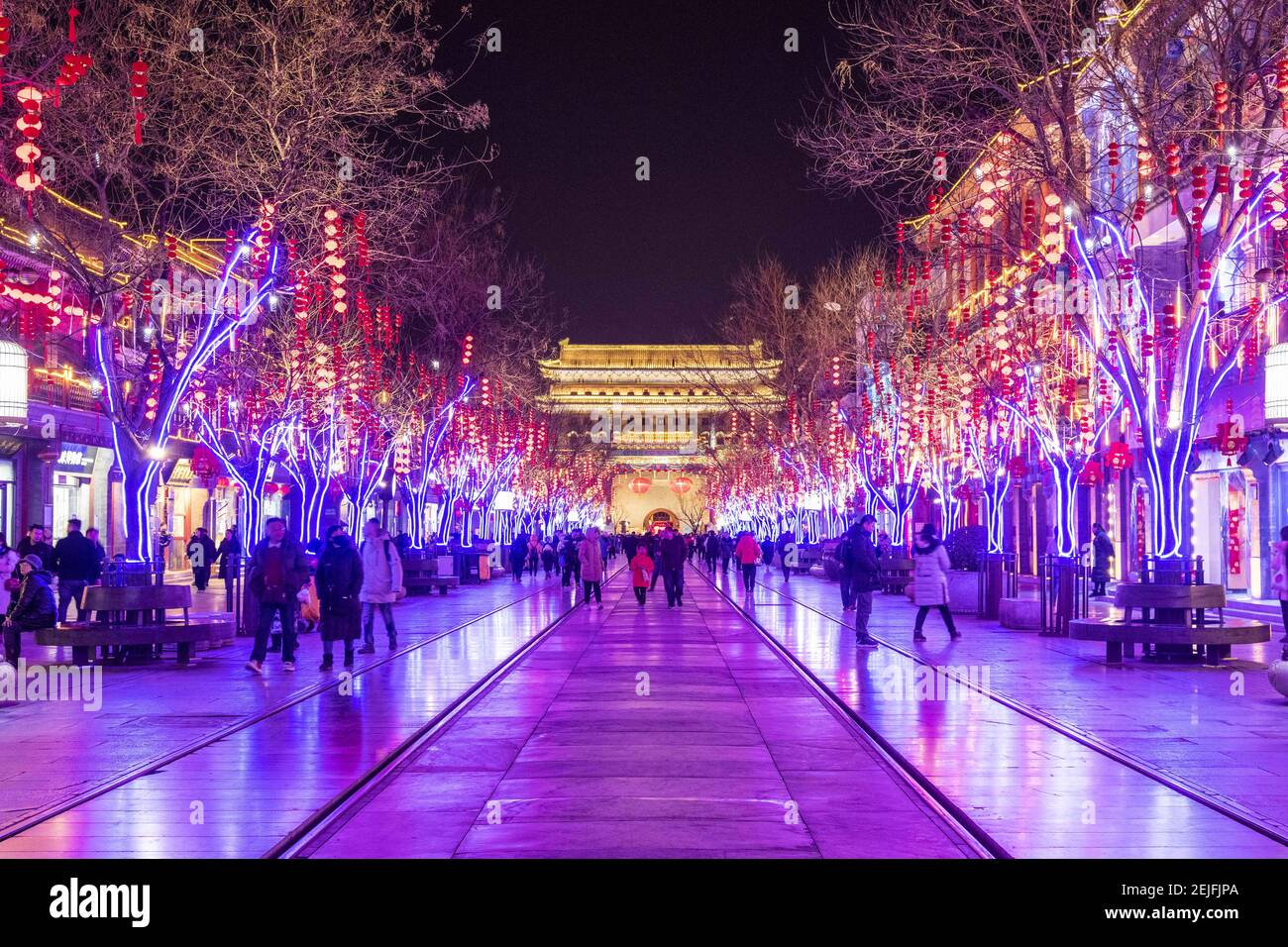 Pedestrians walk in Qianmen Walking Street where all lights turn on to celebrate the upcoming Spring Festival, Beijing, China, 20 January 2020. Stock Photo