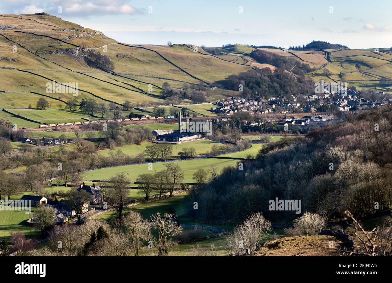 View over the market town of Settle, North Yorkshire, with a minerals train passing along the Settle-Carlisle railway line.. Stock Photo
