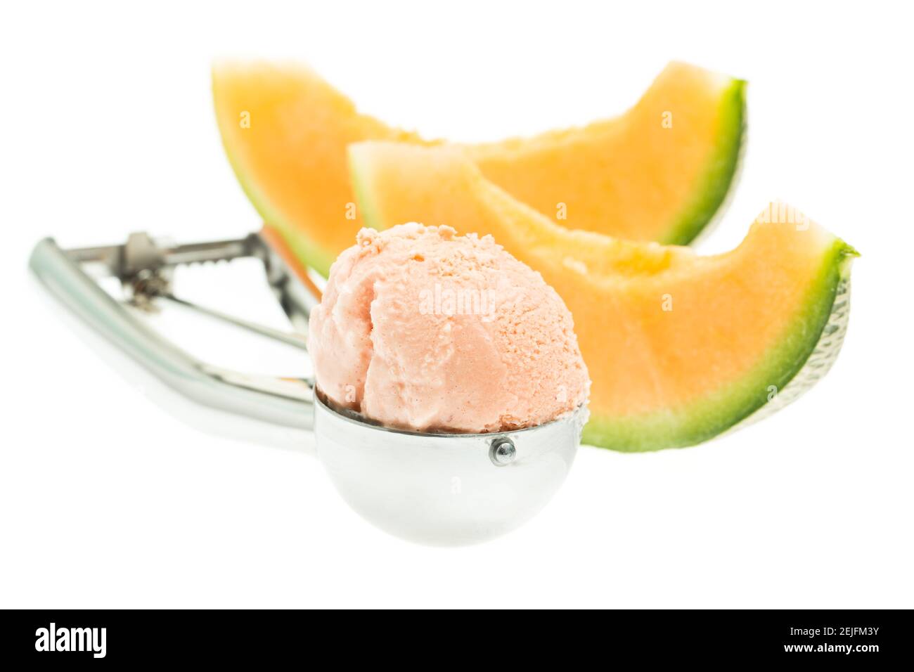 Melon ice cream scoop with melon isolated on white background with spoon Stock Photo