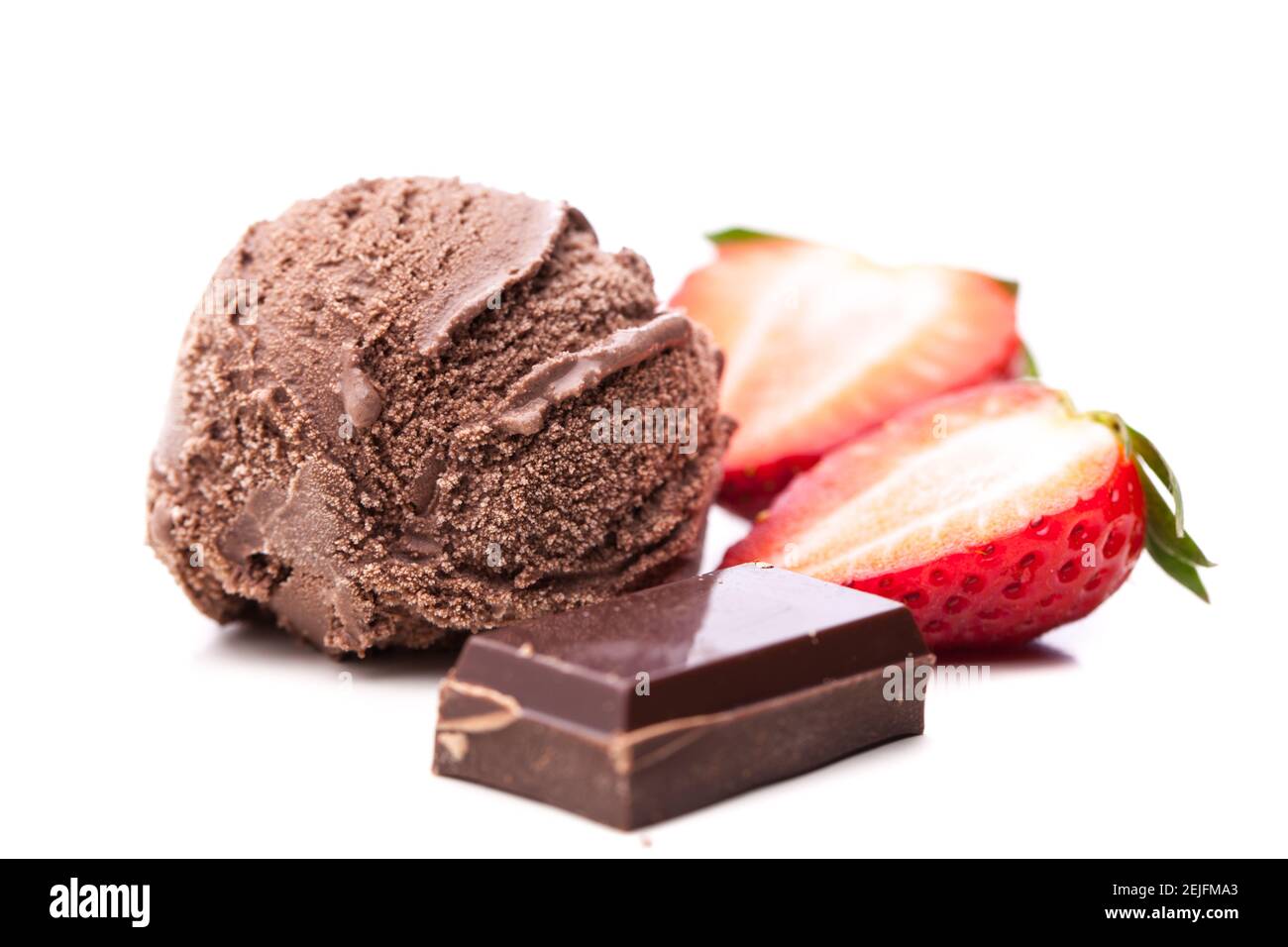 single chocolate ice cream scoop with chocolate and strawberry slices Stock Photo