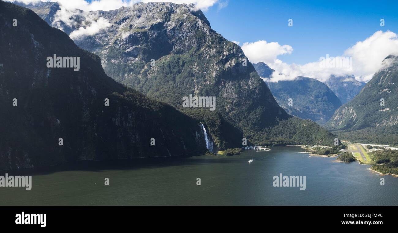 Lake with mountain range in the background, Milford Sound, South Island, New Zealand Stock Photo