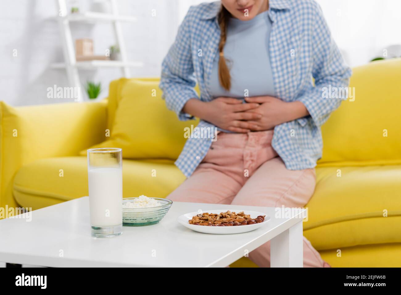 Woman stomach ache milk hires stock photography and images Alamy