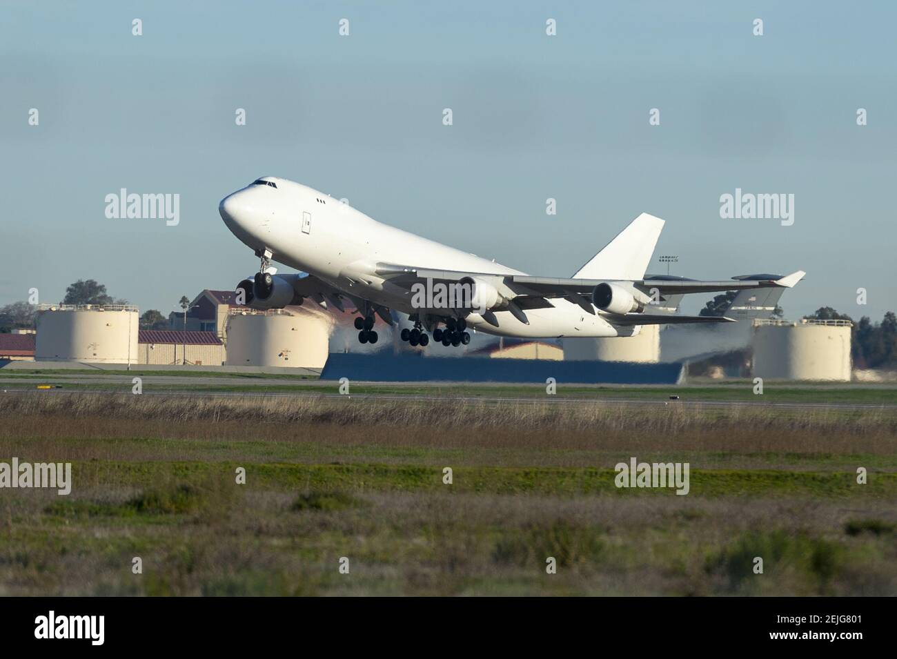 A white government chartered Boeing 747-400F cargo plane is seen departing for Marine Corps Air Station Miramar in San Diego with Americans evacuated from Wuhan, the epicenter of China coronavirus outbreak, at Travis Air Force Base in Fairfield, California, United States on February 5, 2020. Travis Air Force Base and Marine Corps Air Station Miramar are prepared to house hundreds of Americans returning from China for quarantine due to the novel coronavirus outbreak. (Photo by Yichuan Cao/Sipa USA) Stock Photo