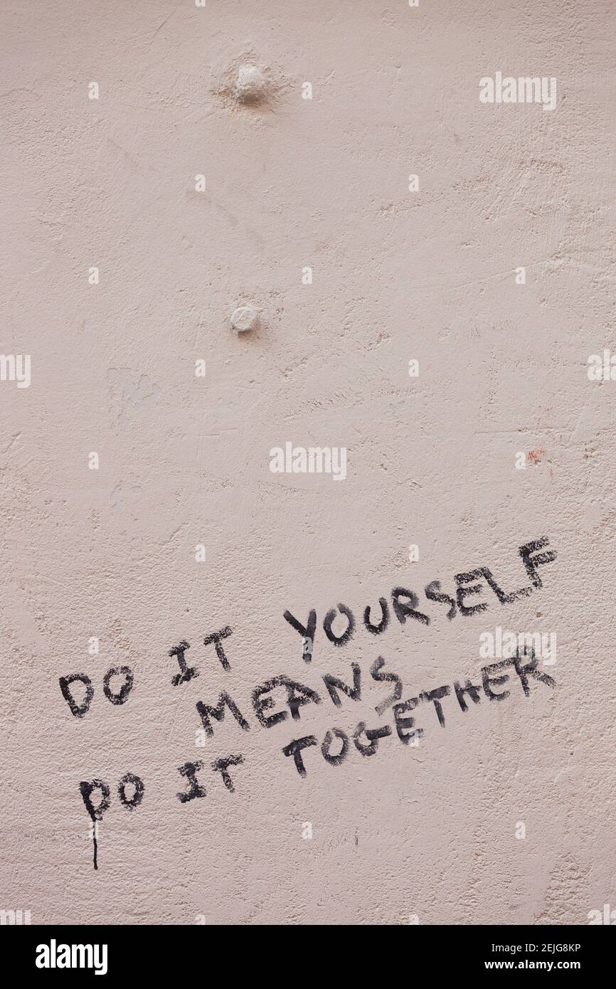 Do it yourself means do it together sign on wall, Altstadt, Freiburg Im Breisgau, Black Forest, Baden-Wurttemberg, Germany Stock Photo
