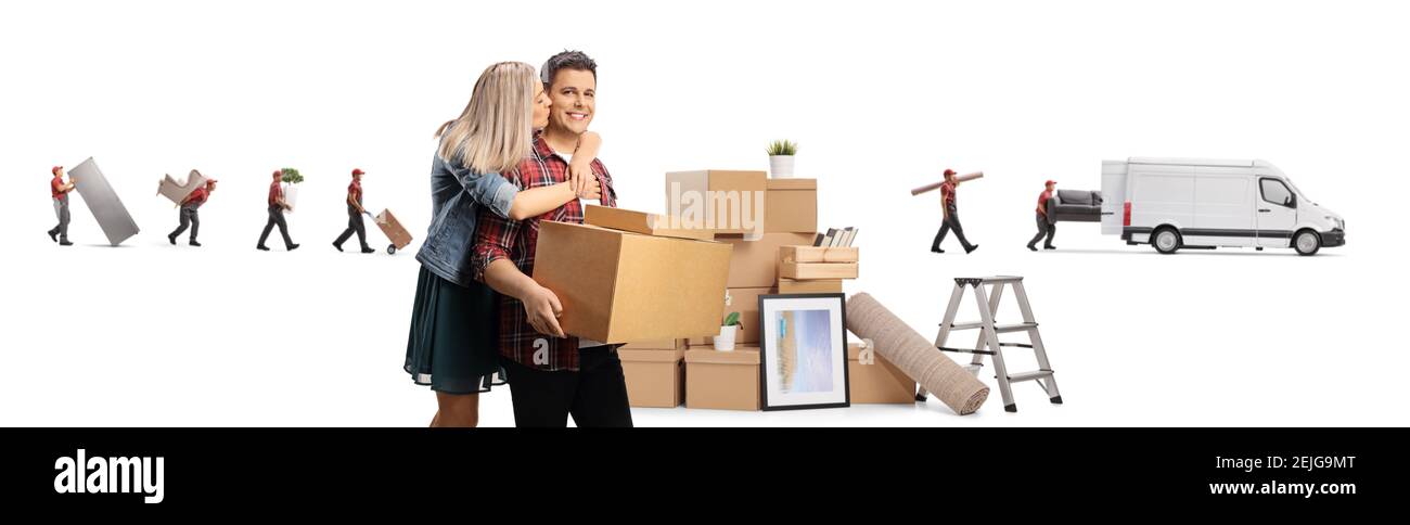 Excited woman kissing man with cardboard boxes and workers from a moving company with a transport van isolated on white background Stock Photo