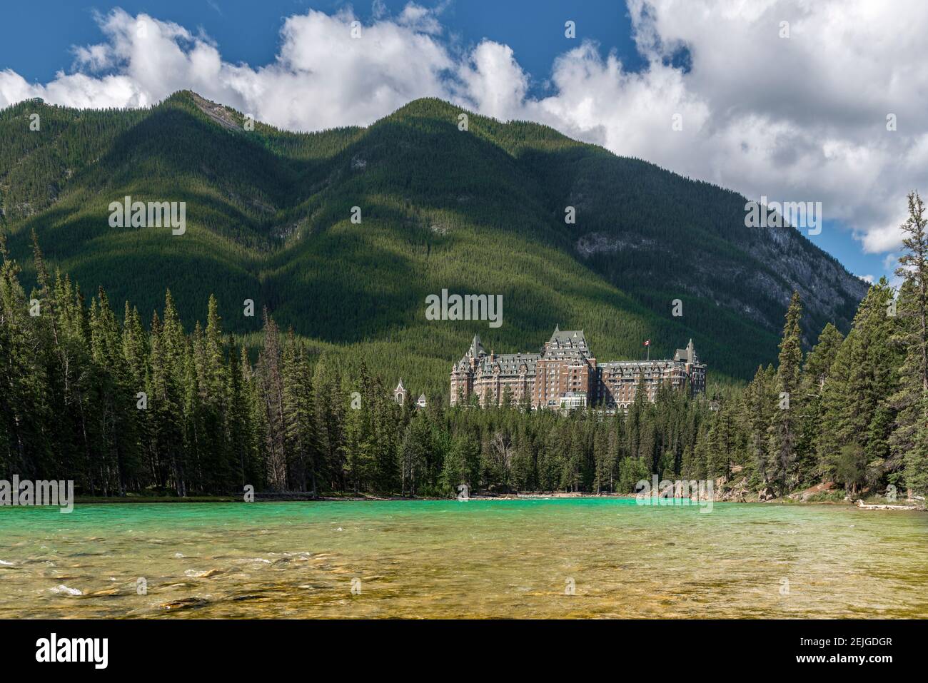 Banff Springs Hotel by Bow River in Banff National Park, Alberta, Canada Stock Photo