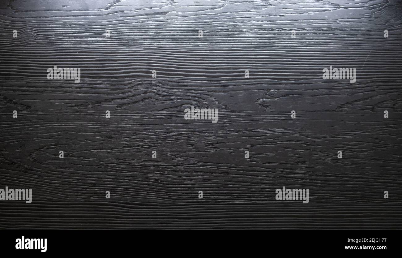 dark wooden plank , deep texture with light. background Stock Photo