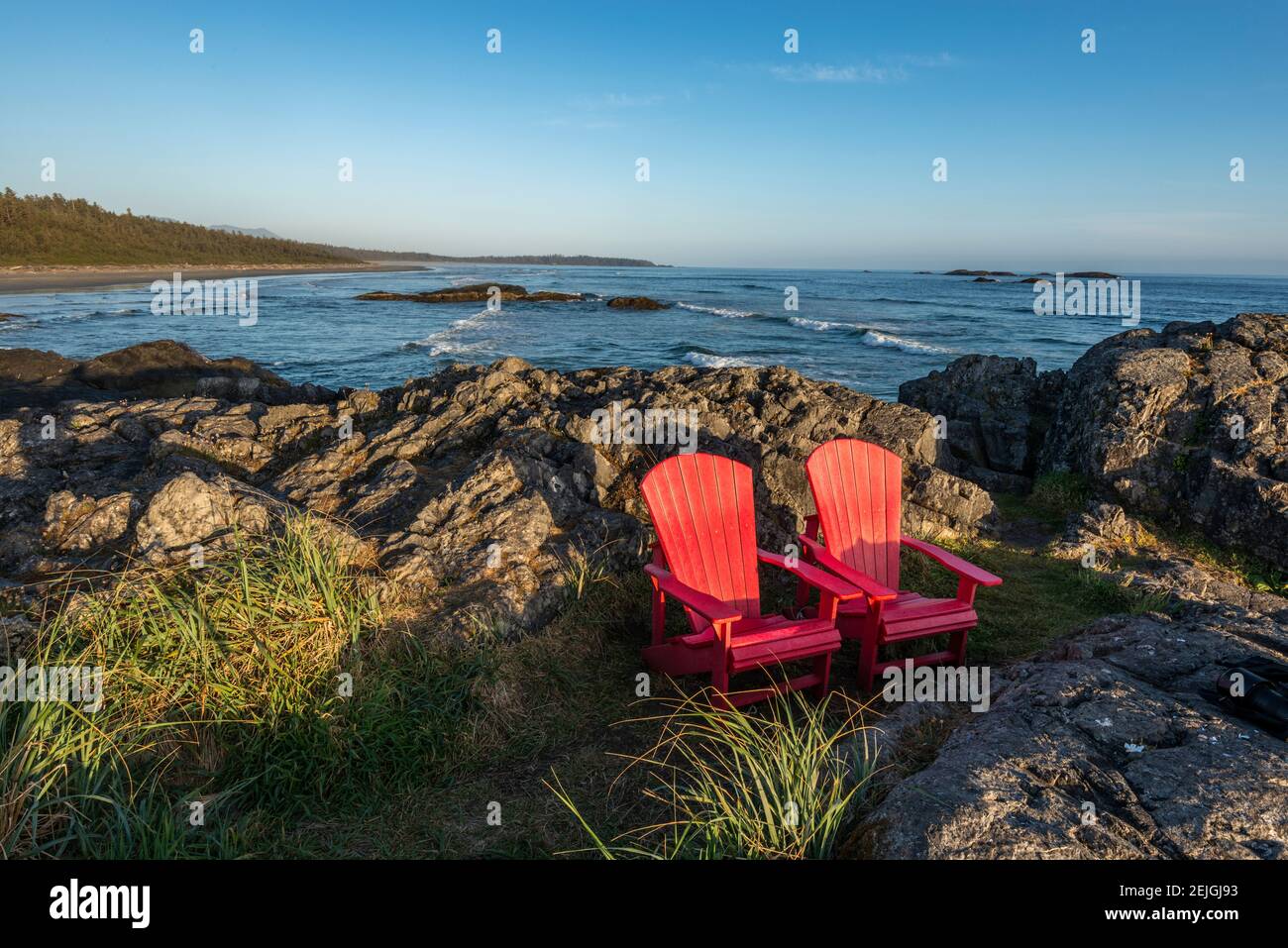Empty red chairs at coast, Pacific Rim National Park Reserve, Vancouver Island, British Columbia, Canada Stock Photo