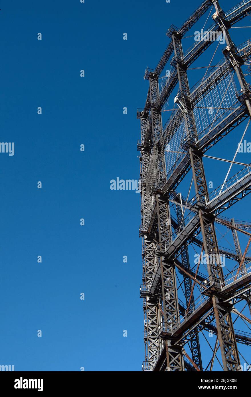 Berlin, Germany. 22nd Feb, 2021. Struts of the gasometer stand in front of a blue sky. The participation procedure for the conversion of the listed Gasometer ends on 24 February. If the owner has his way, the over 100-year-old steel construction is to be given a new lease of life as the shell of an office building. However, a citizens' initiative wants to prevent this and is calling for signatures on a petition. Credit: Paul Zinken/dpa-Zentralbild/ZB/dpa/Alamy Live News Stock Photo