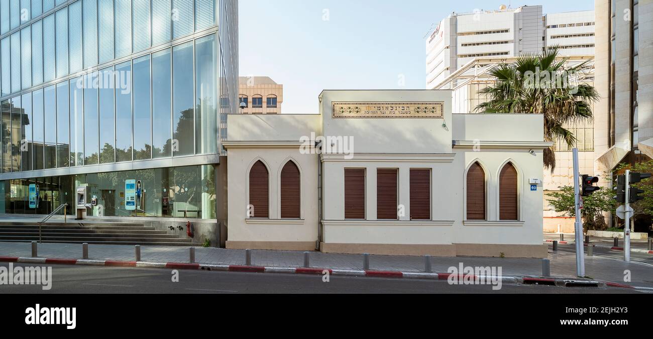 Old reconstructed edifice with glassed office building in Rothschild Boulevard, Tel Aviv, Israel Stock Photo