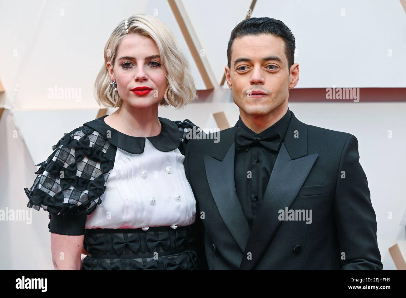 Lucy Boynton and Rami Malek walking on the red carpet at the 92nd(02)