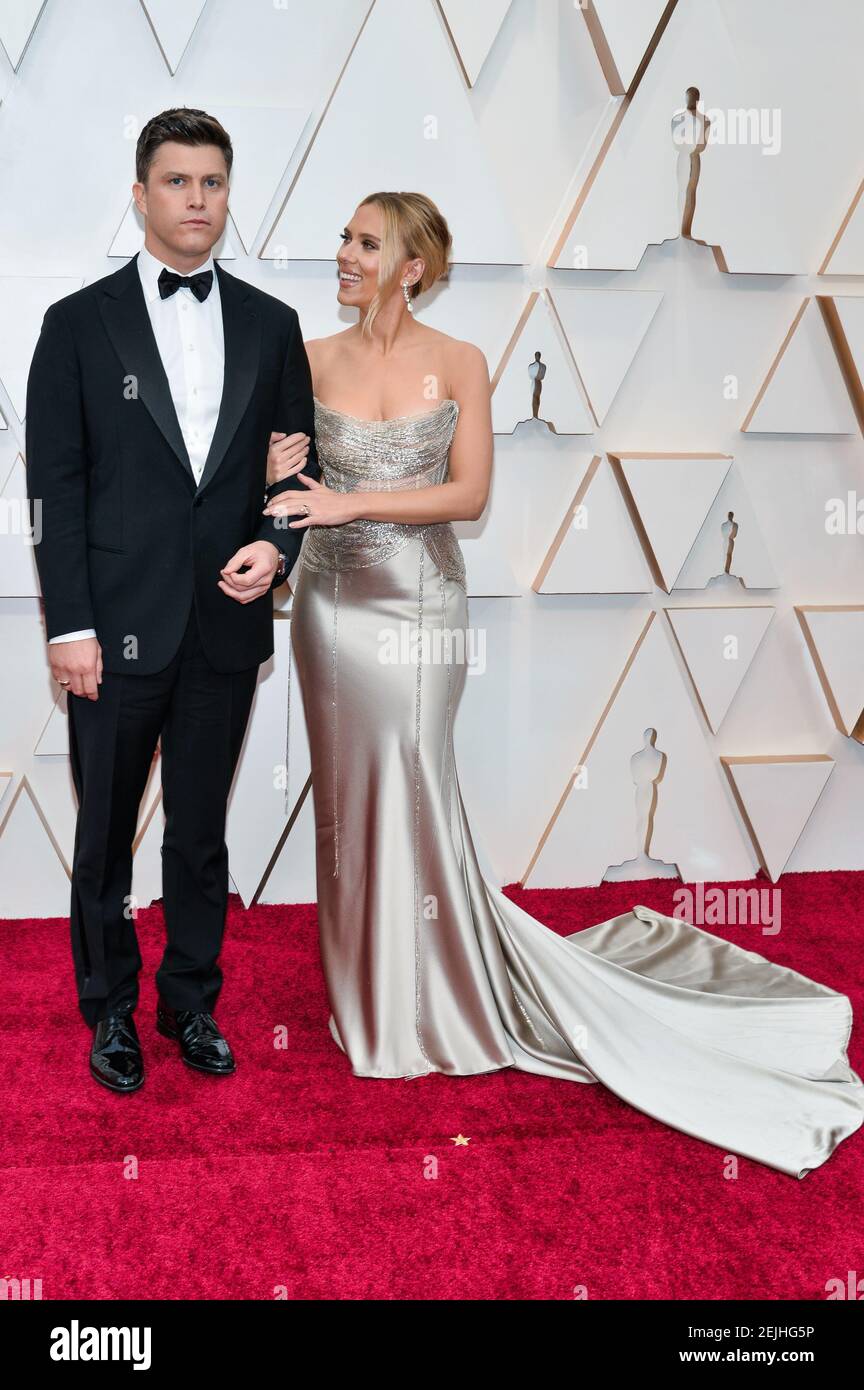 Colin Jost and Scarlett Johansson walking on the red carpet at the 92nd