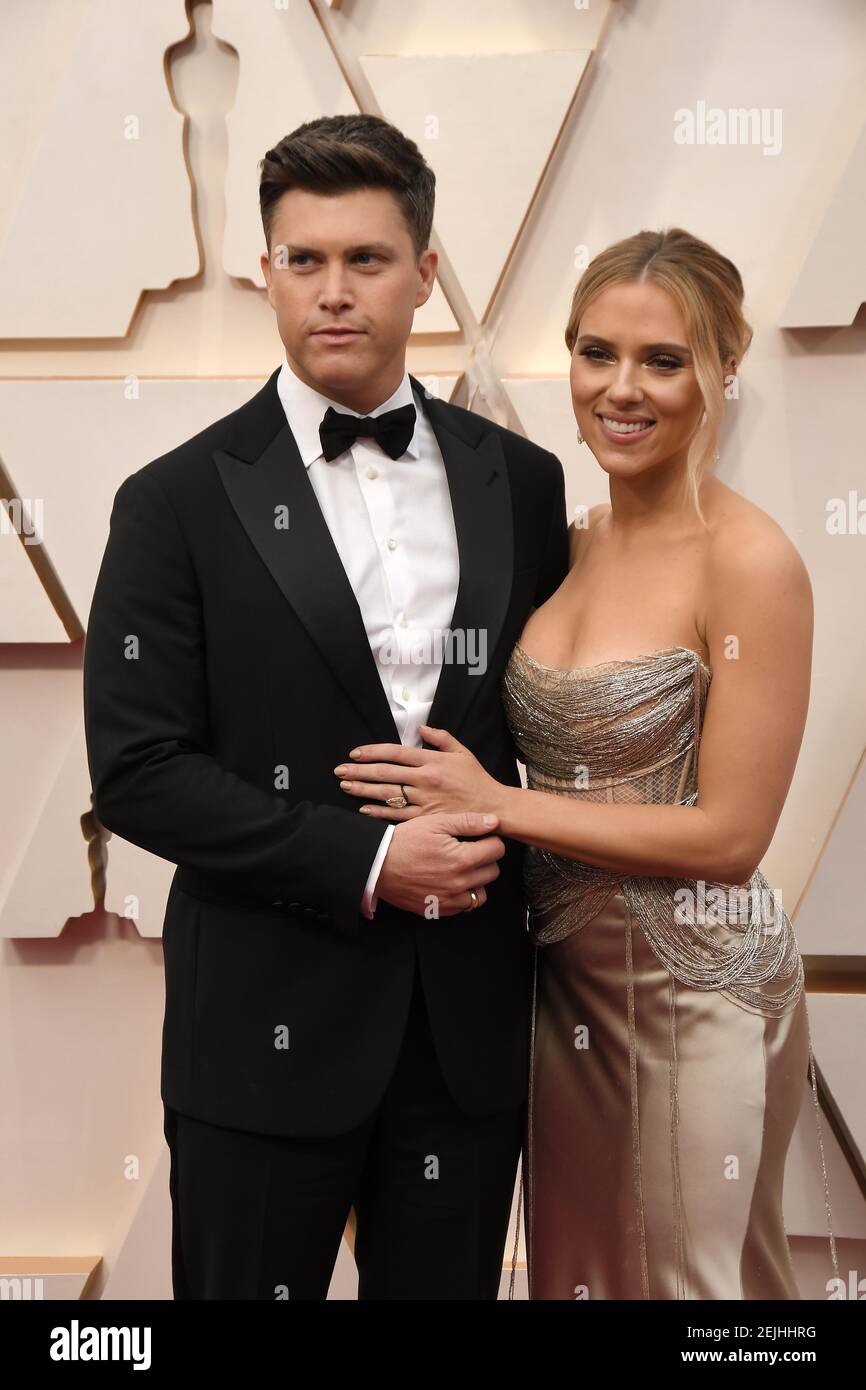 Colin Jost and Scarlett Johansson walking on the red carpet at the 92nd