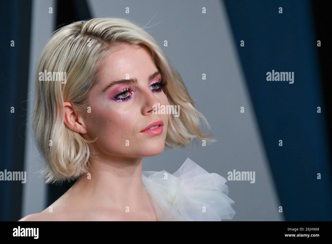 Lucy Boynton walking on the red carpet at the 2020 Vanity Fair Oscar ...