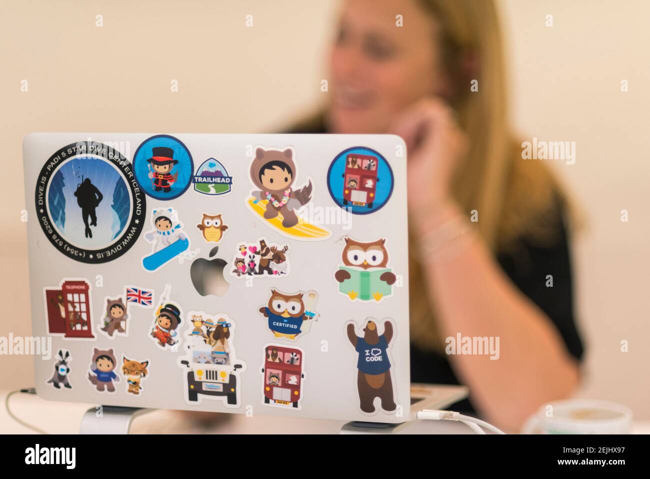 a personalised mac book lap top with stickers on the outside Stock Photo